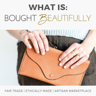 What is Bought Beautifully? Woman holds fair trade accessories