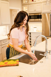 Thumbnail for Woman washing dishes in a modern kitchen